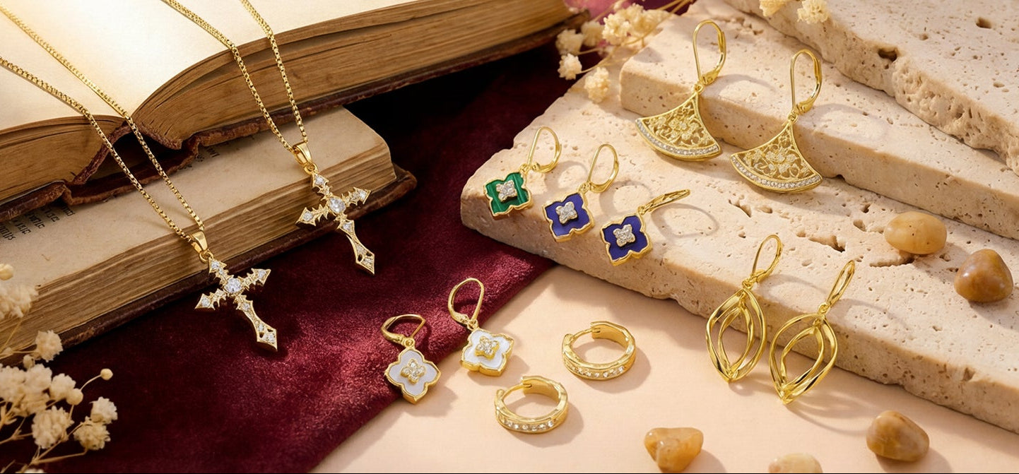 Jewelry including rings and necklaces on a textured surface with an open book.