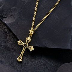 Gold cross necklace on slate: black-enamel cross pendant on chunky chain