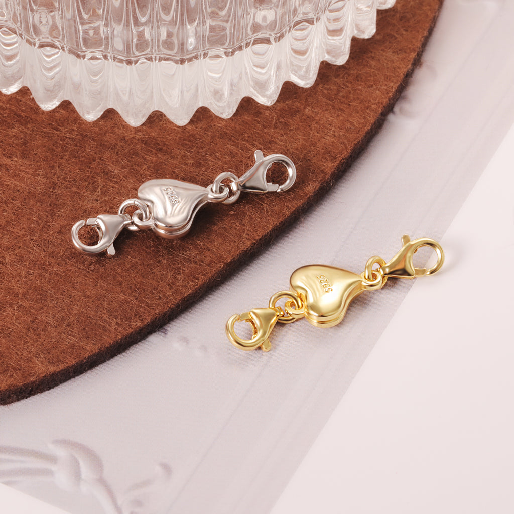 Heart chain extender in silver and gold, both with heart charm and clasp ends