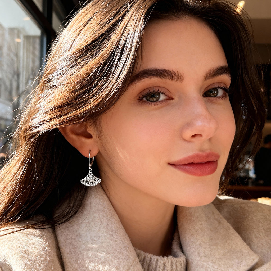 Silver-tone fan drop earrings with crescent filigree and rhinestone detail