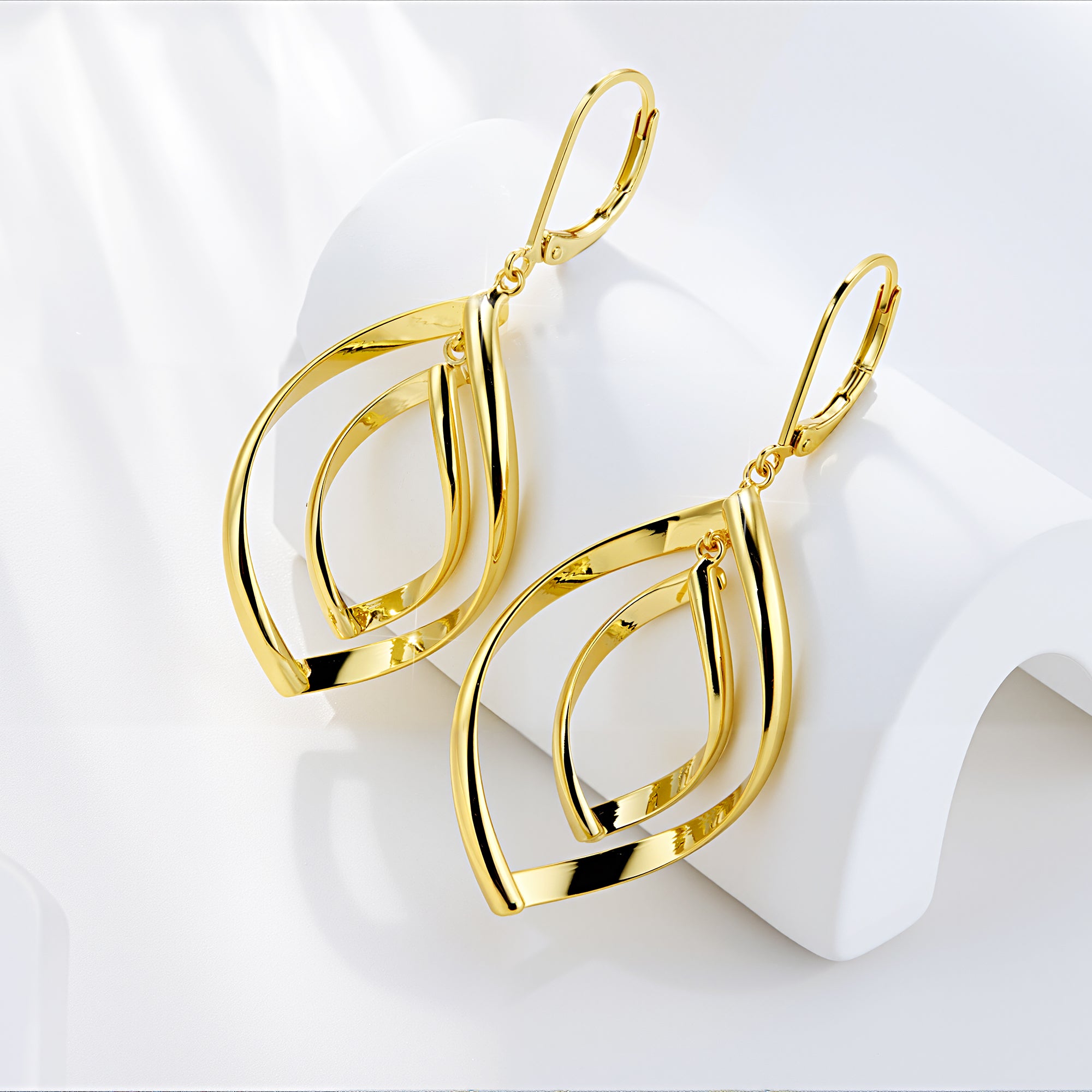 Gold Double Twist drop earrings, front view of nested teardrop loops