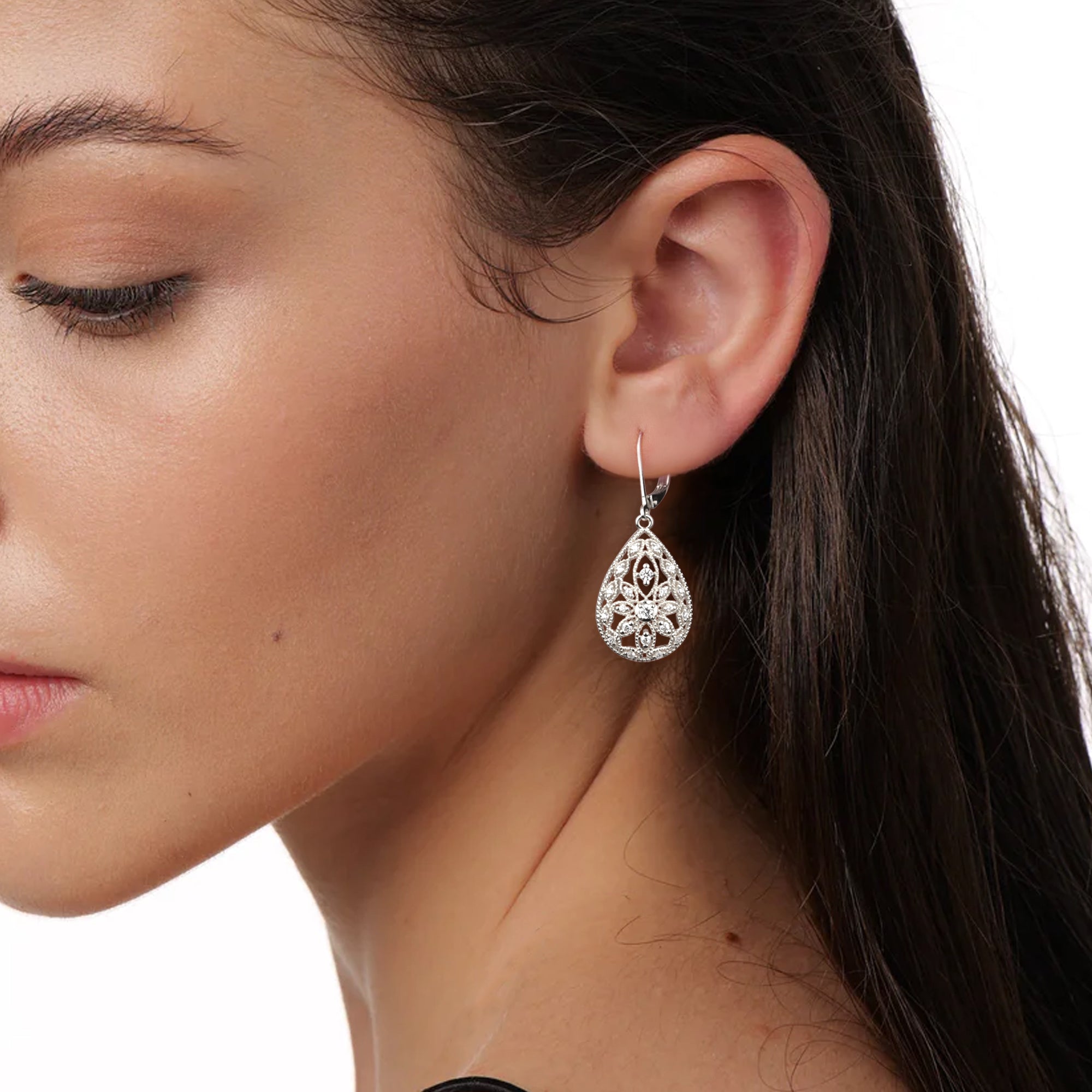 Silver Filigree CZ dangle earring close-up, teardrop filigree with sparkling round stones.