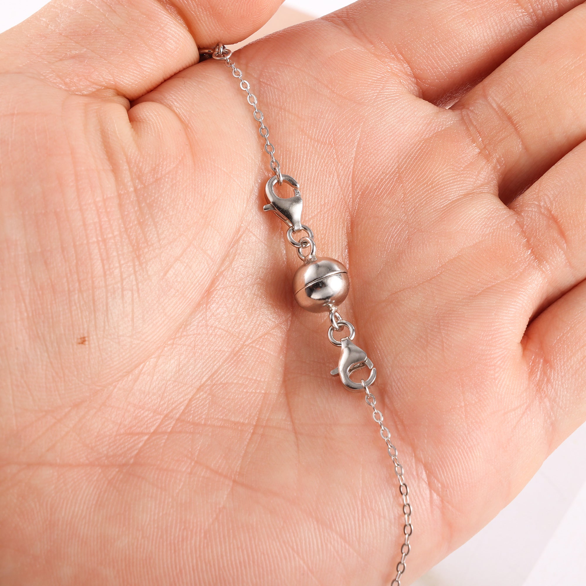 Silver-tone extender chain with rounded ball links and small clasp at the end