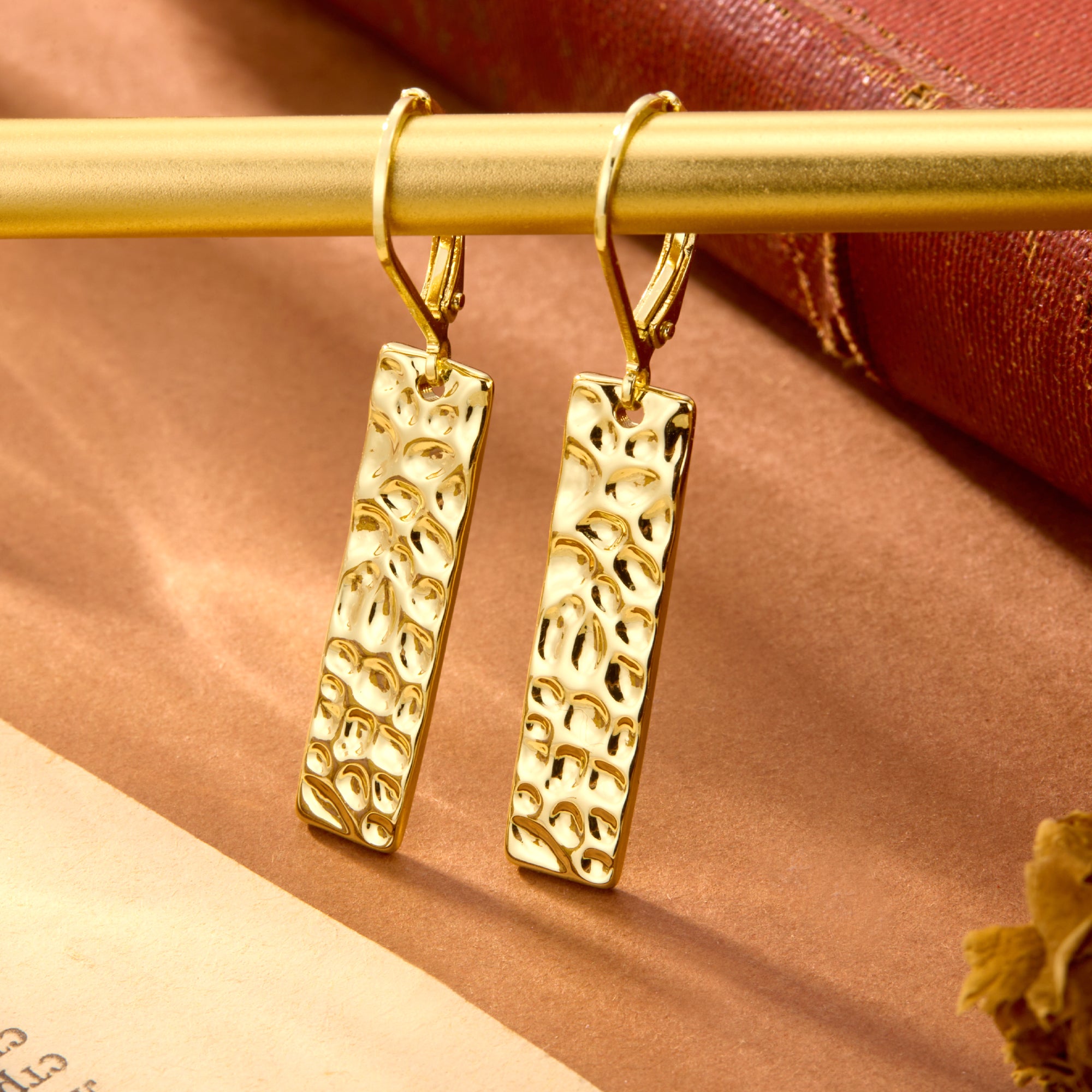 Gold-tone square hammered bar drop earrings with curved lever-back hoops