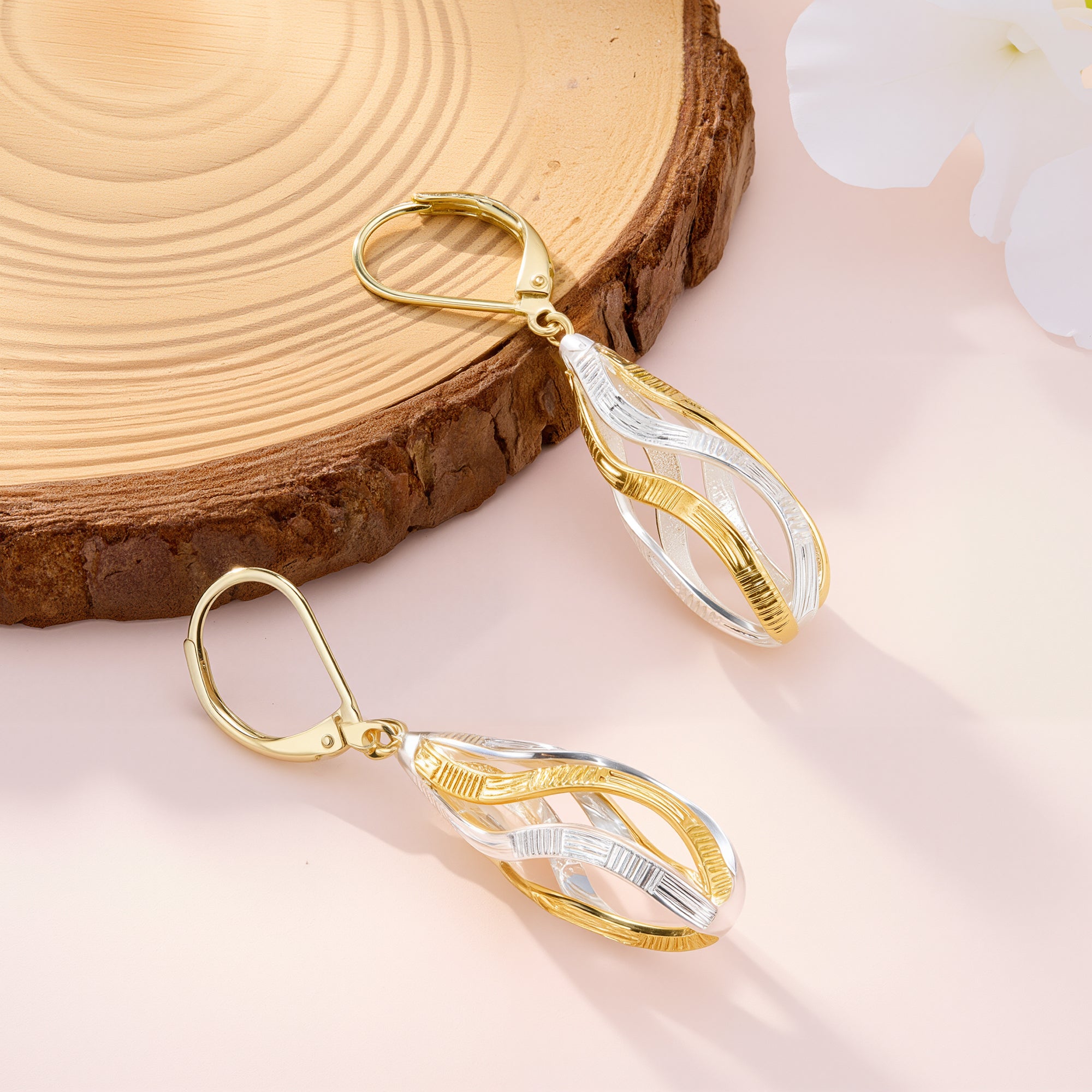 Two-tone teardrop dangle earring, gold top loop with silver ridged drop and accents