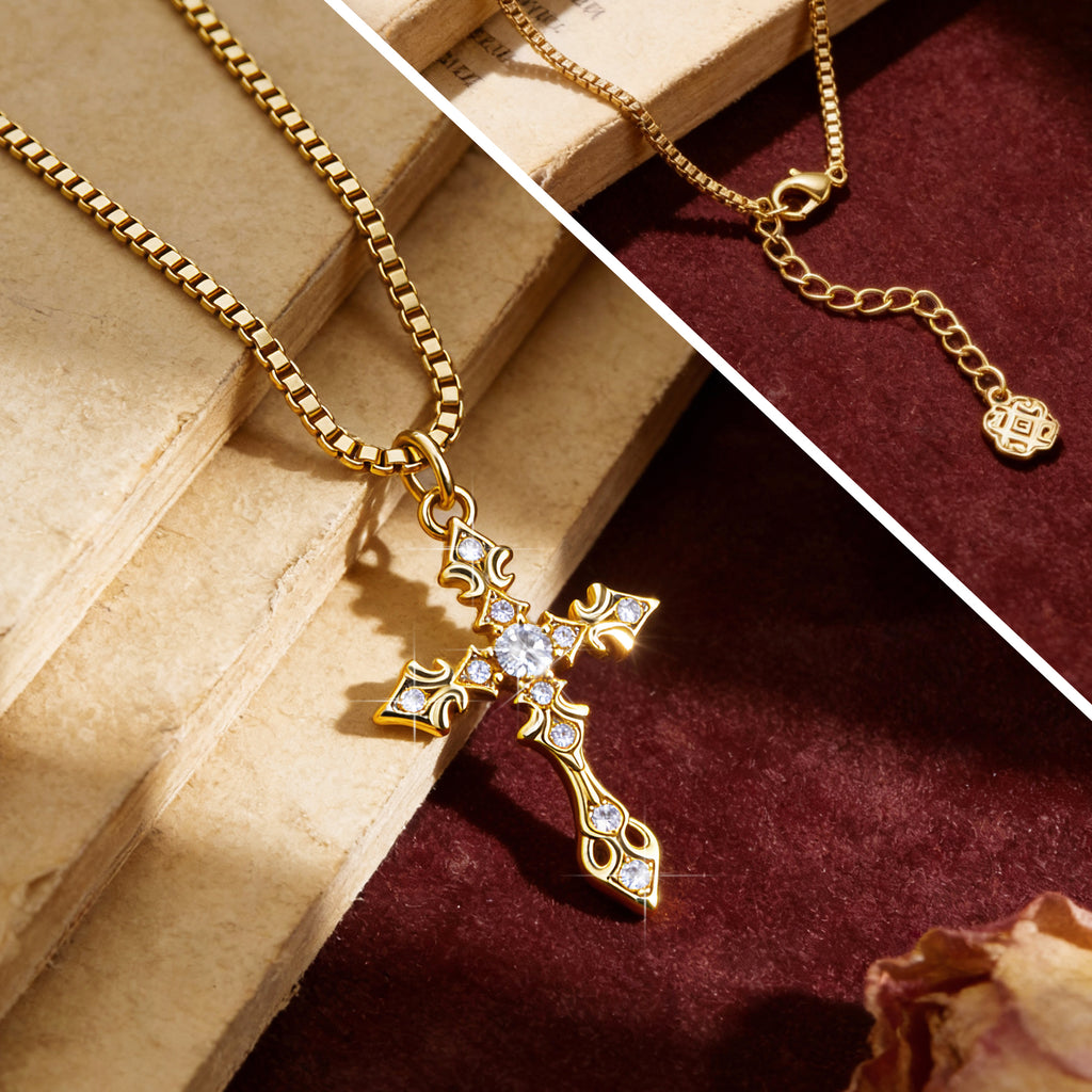 Close-up CZ cross pendant on gold-tone chain, blue zirconia stones
