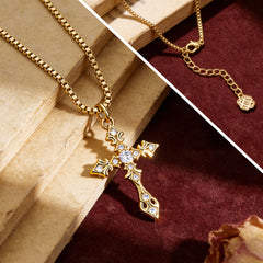 Close-up CZ cross pendant on gold-tone chain, blue zirconia stones