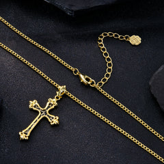 Gold cross necklace and clasp view; black-enamel cross pendant and knot charm