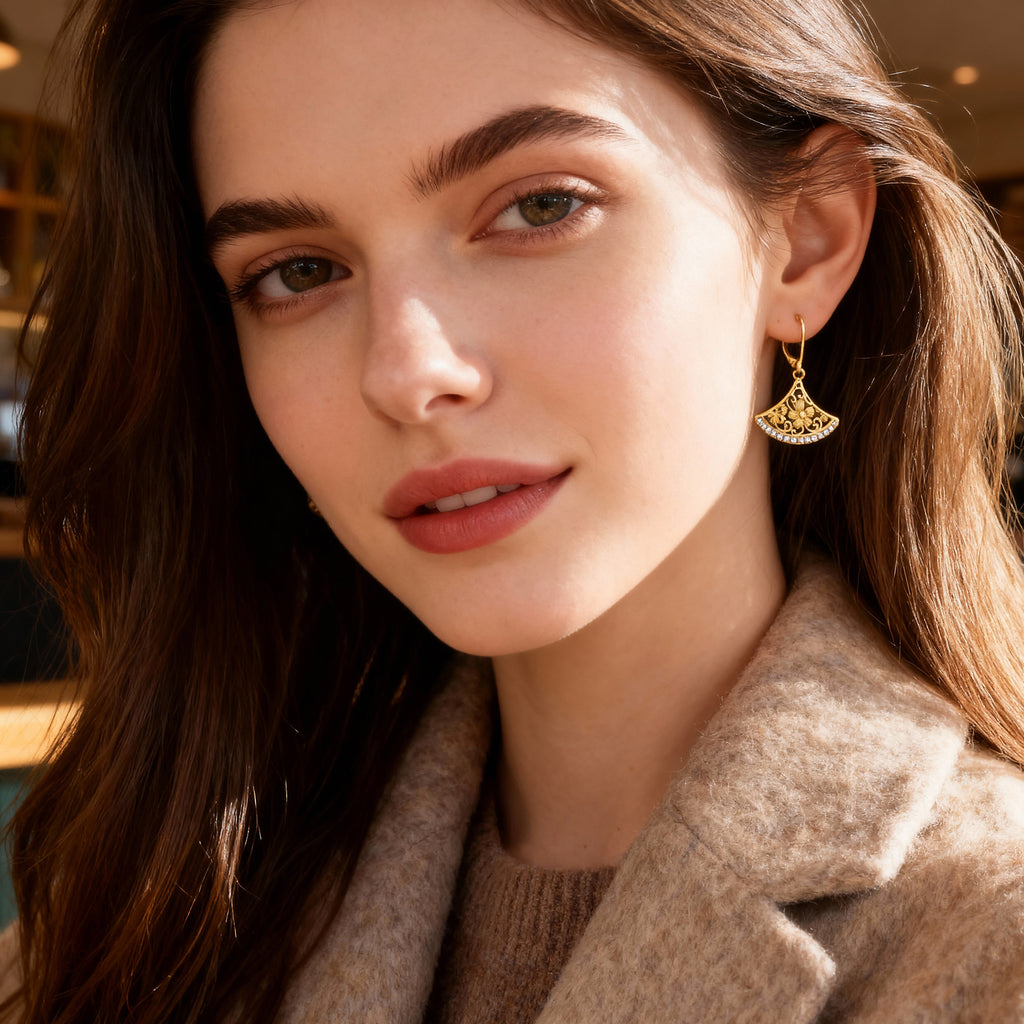 Gold-tone fan drop earrings with filigree crescent design and sparkle stones