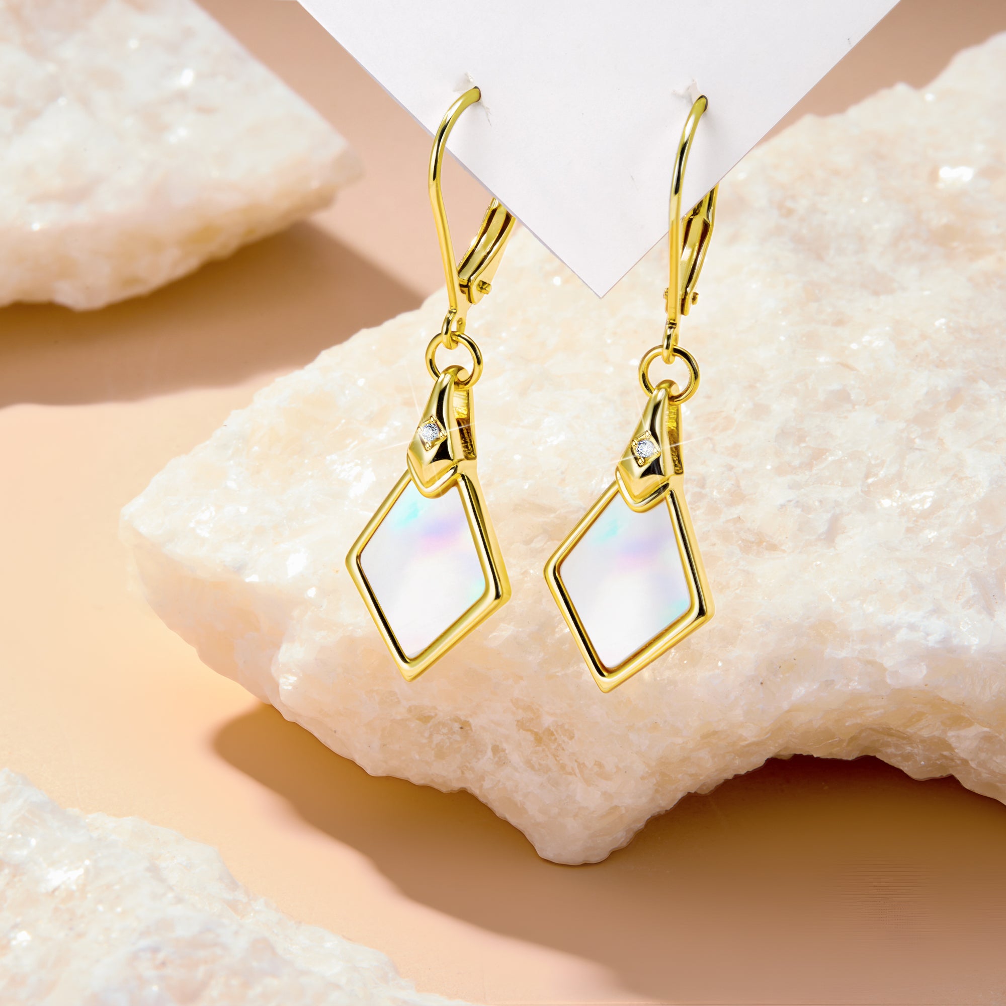 Iridescent Pearl Shell rhombus drop earrings with gold-tone bezel and clear accent stone
