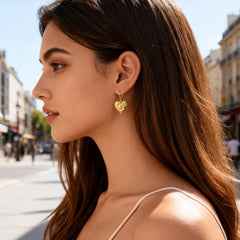 Molten Heart French drop earrings on model, small gold heart drop with hinged hook