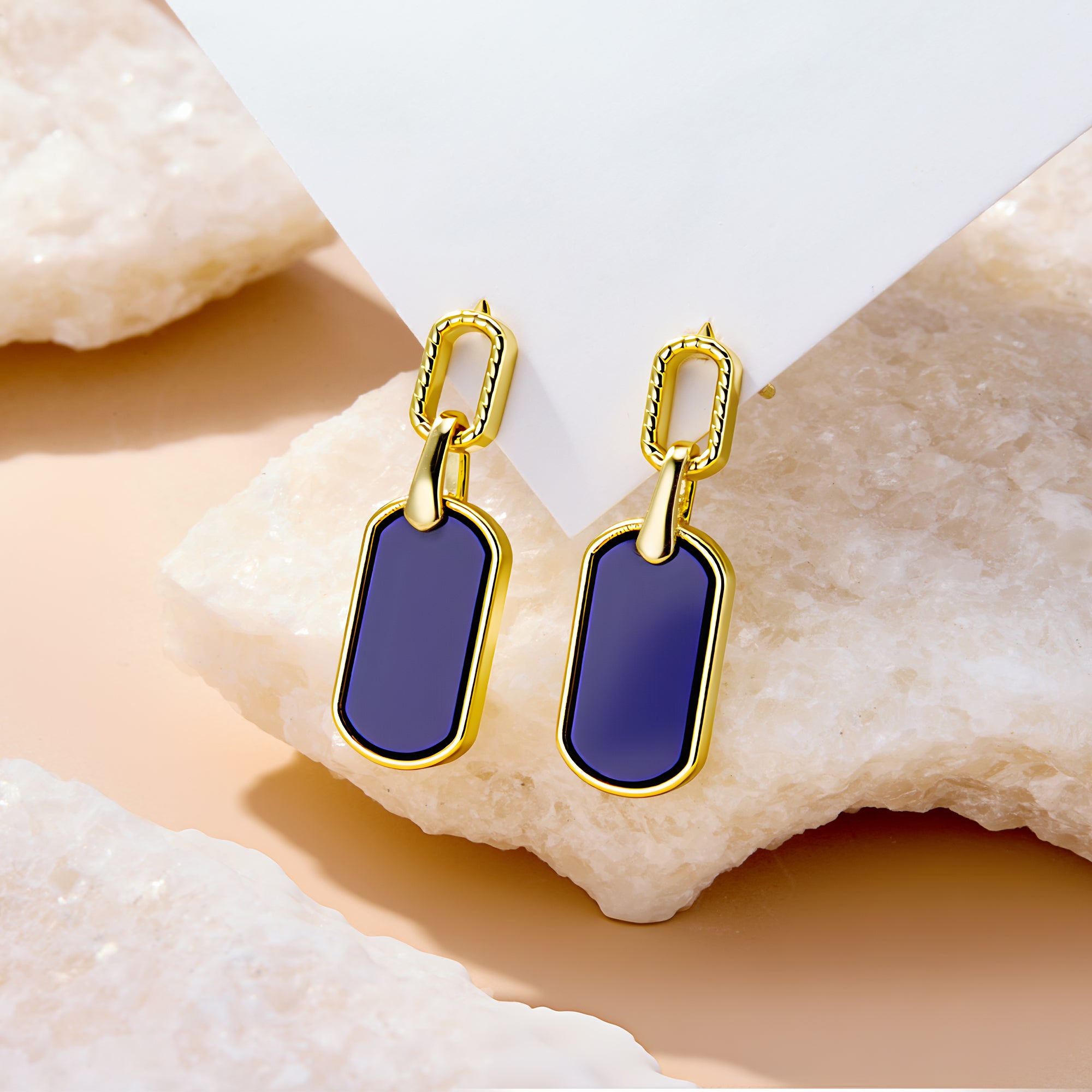Lapis lazuli style statement earrings, gold-tone bezel and deep blue rectangular dangles.