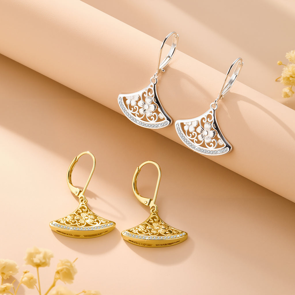 Silver-tone fan drop earrings with crescent filigree and rhinestone-edged border