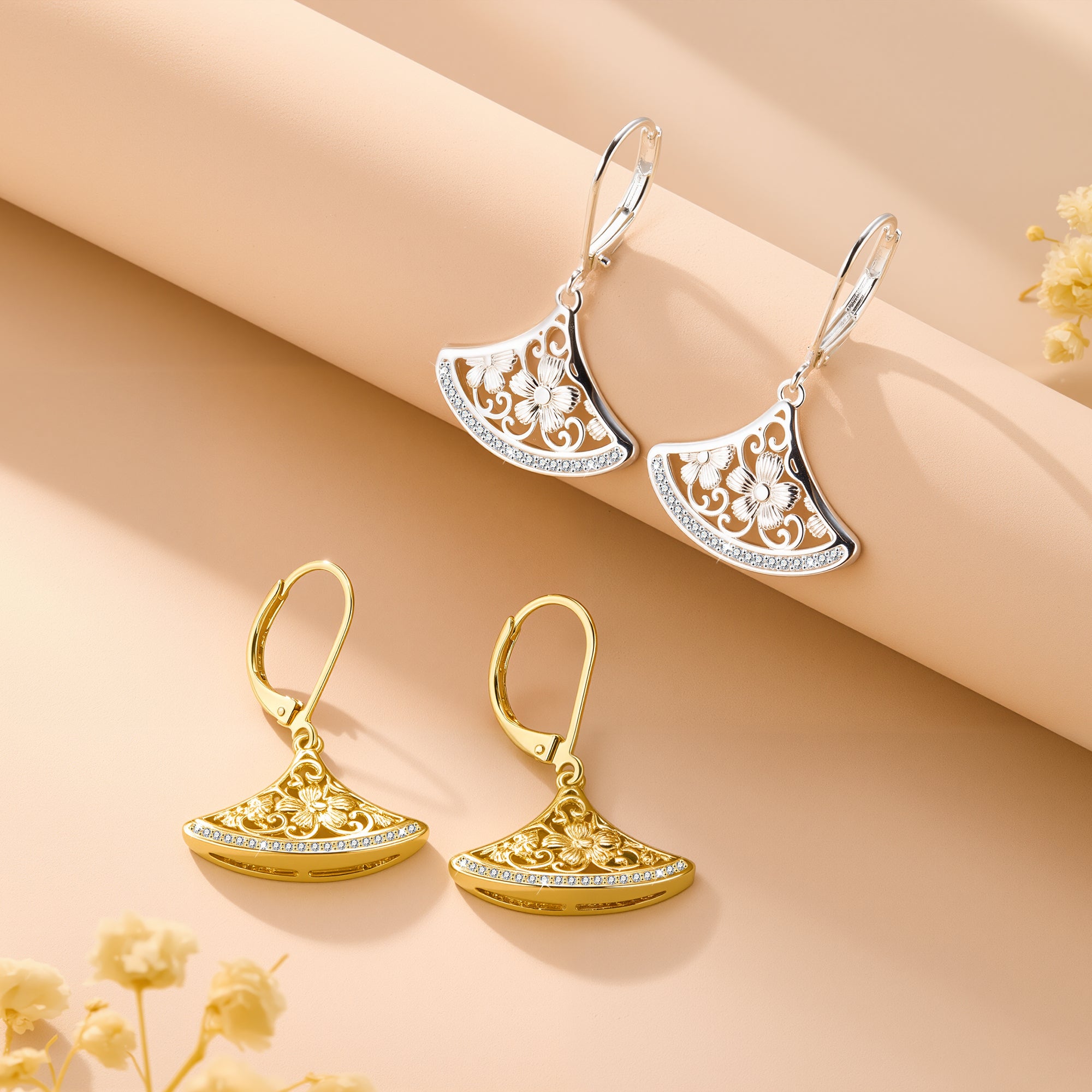 Silver-tone fan drop earrings with crescent filigree and rhinestone-edged border