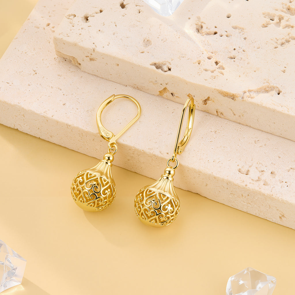 Gold hollow lantern drop earrings with engraved swirl lattice globe and hoop hooks