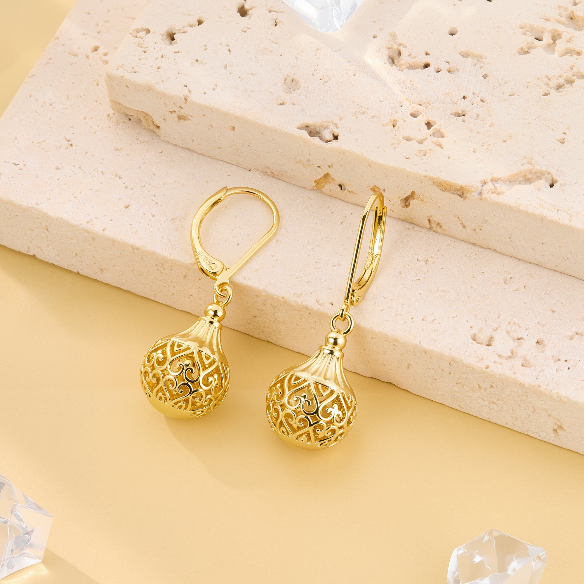 Gold hollow lantern drop earrings with engraved swirl lattice globe and hoop hooks