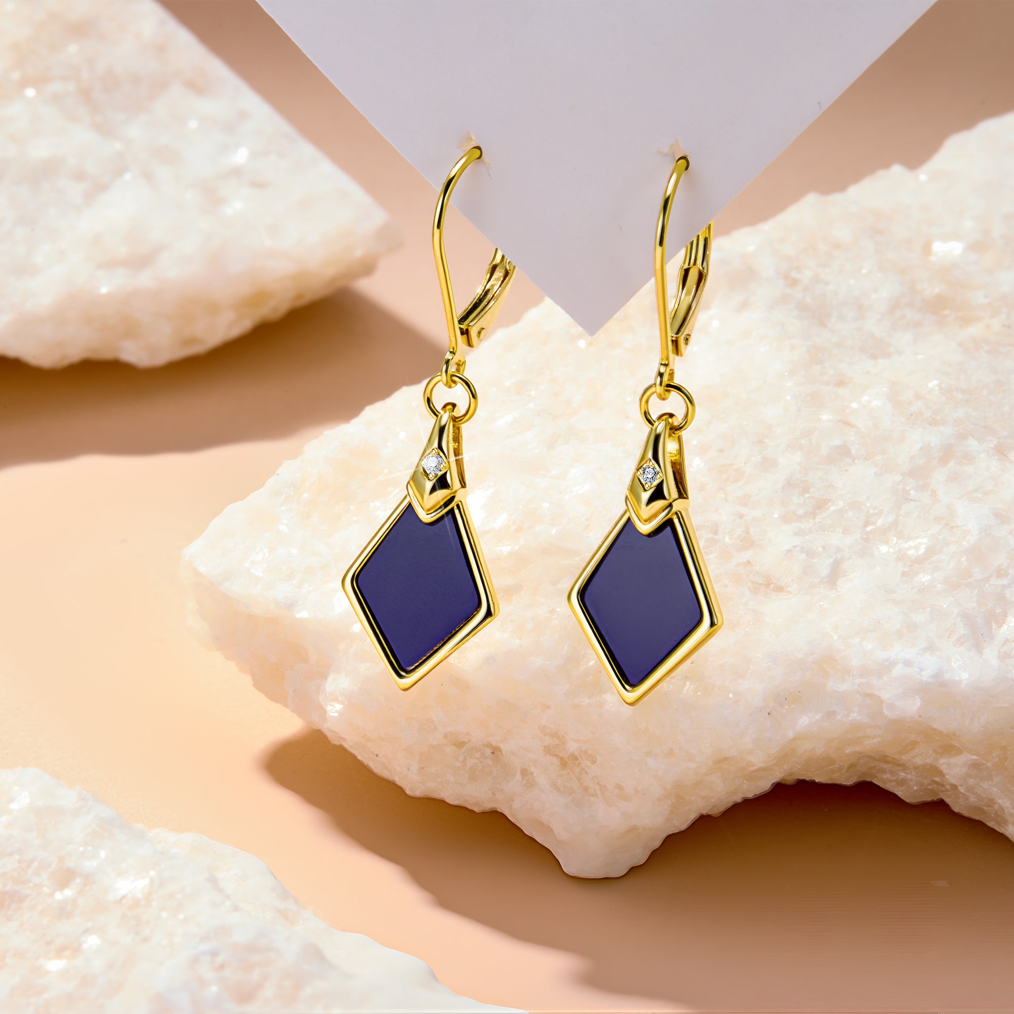 Lapis Lazuli rhombus drop earrings with gold settings and small clear accent details