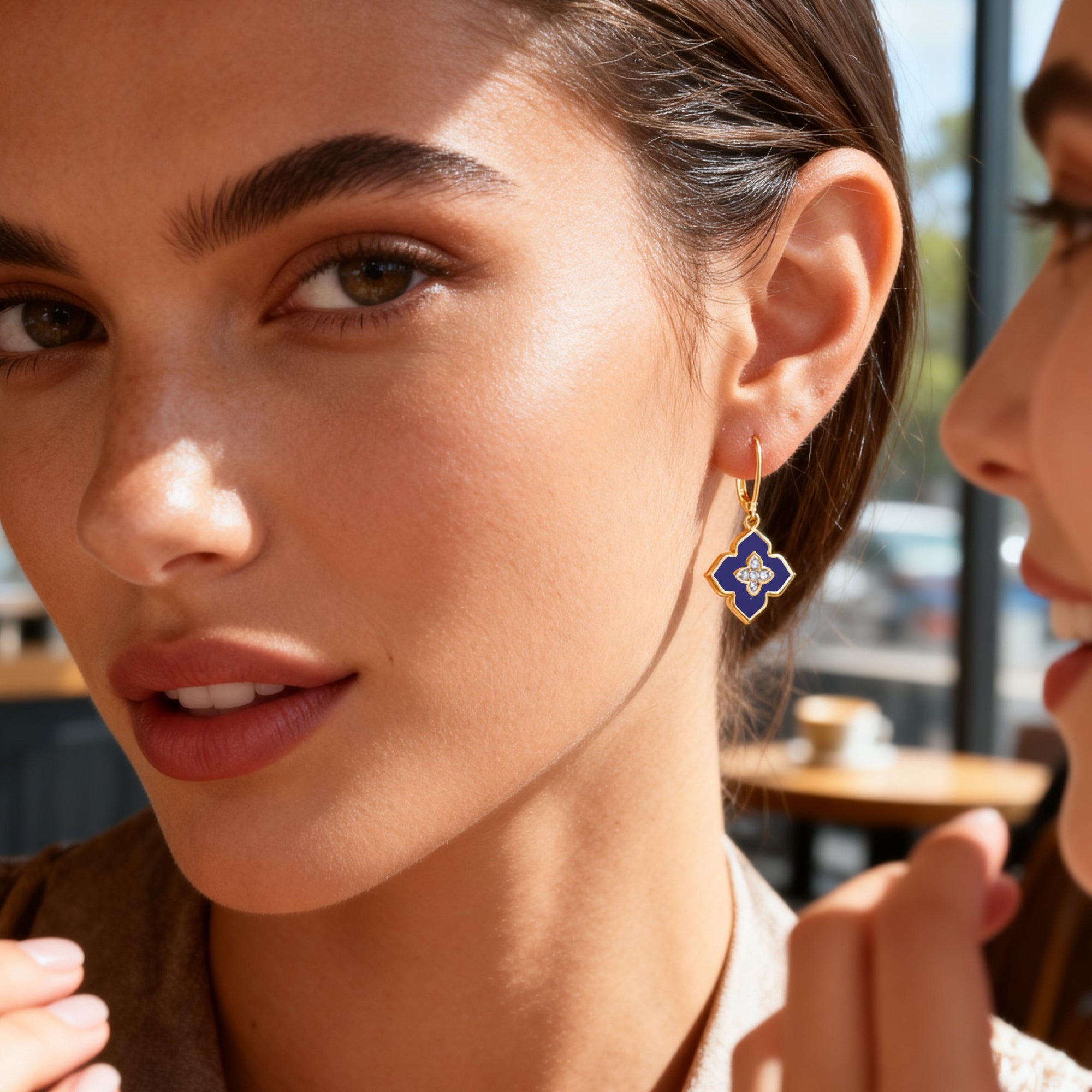 Four-leaf clover drop earrings with lapis lazuli blue enamel and crystal cross