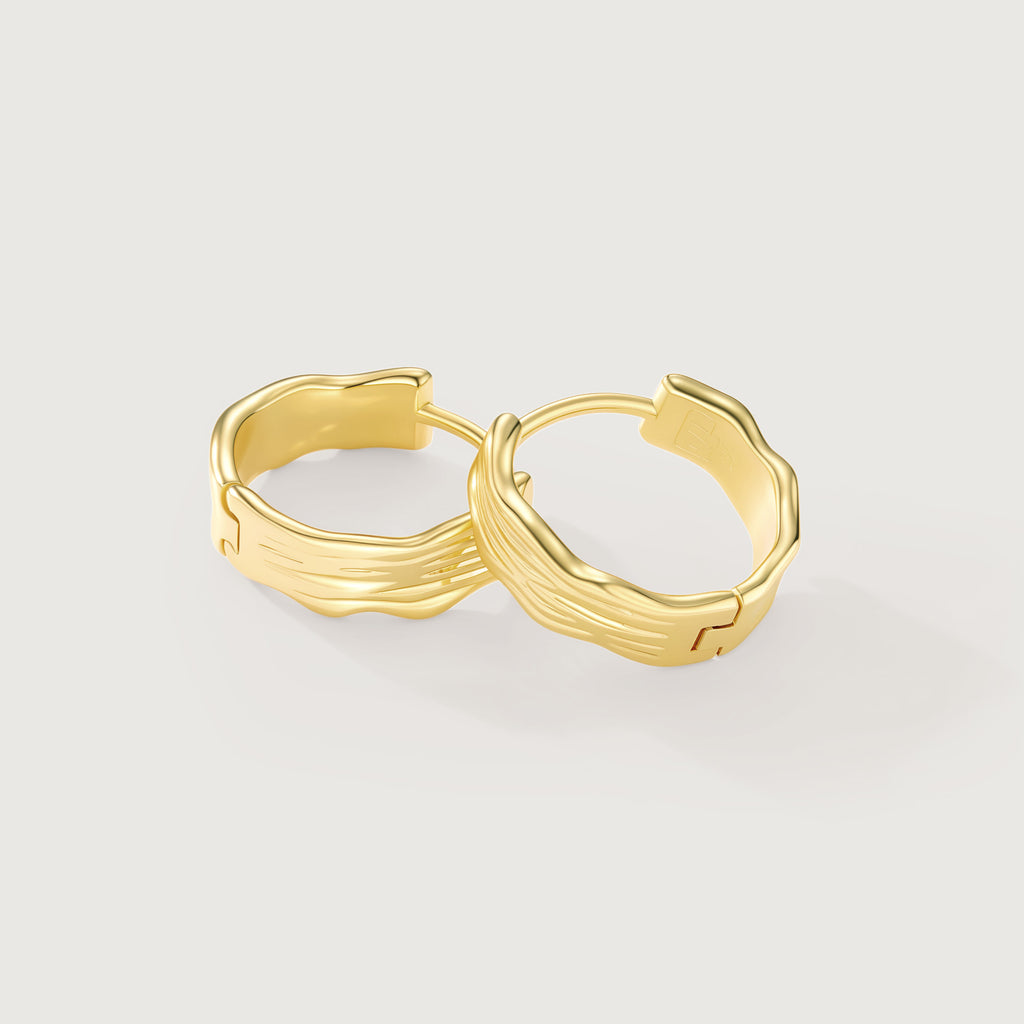 Flowline Textured Huggie Hoop Earrings in 14K Gold-Tone Wavy Ridge Detail Side Angle View on White Background