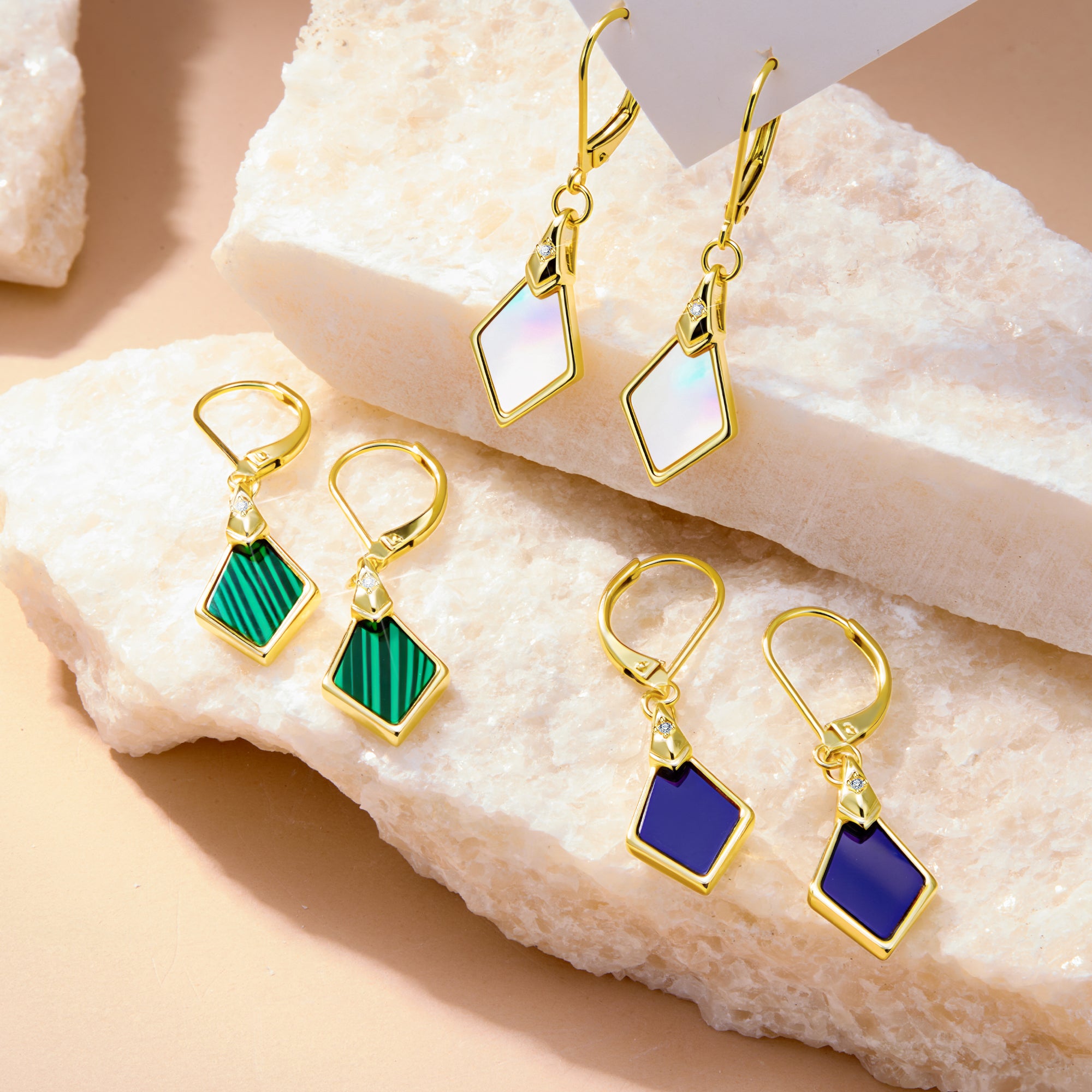 Geometric rhombus drop earrings with gold-tone frames and green and blue stones