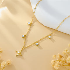 Gold-tone chain necklace with star pendant and round zircon charms along the links
