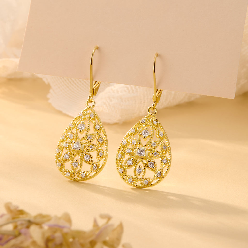 Gold Filigree CZ dangle earrings, teardrop cutout pattern with small round stones.