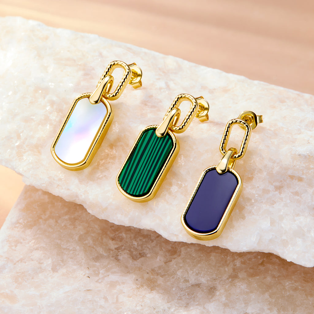 Malachite style statement earrings with green striped rectangular drops and gold-tone frames.