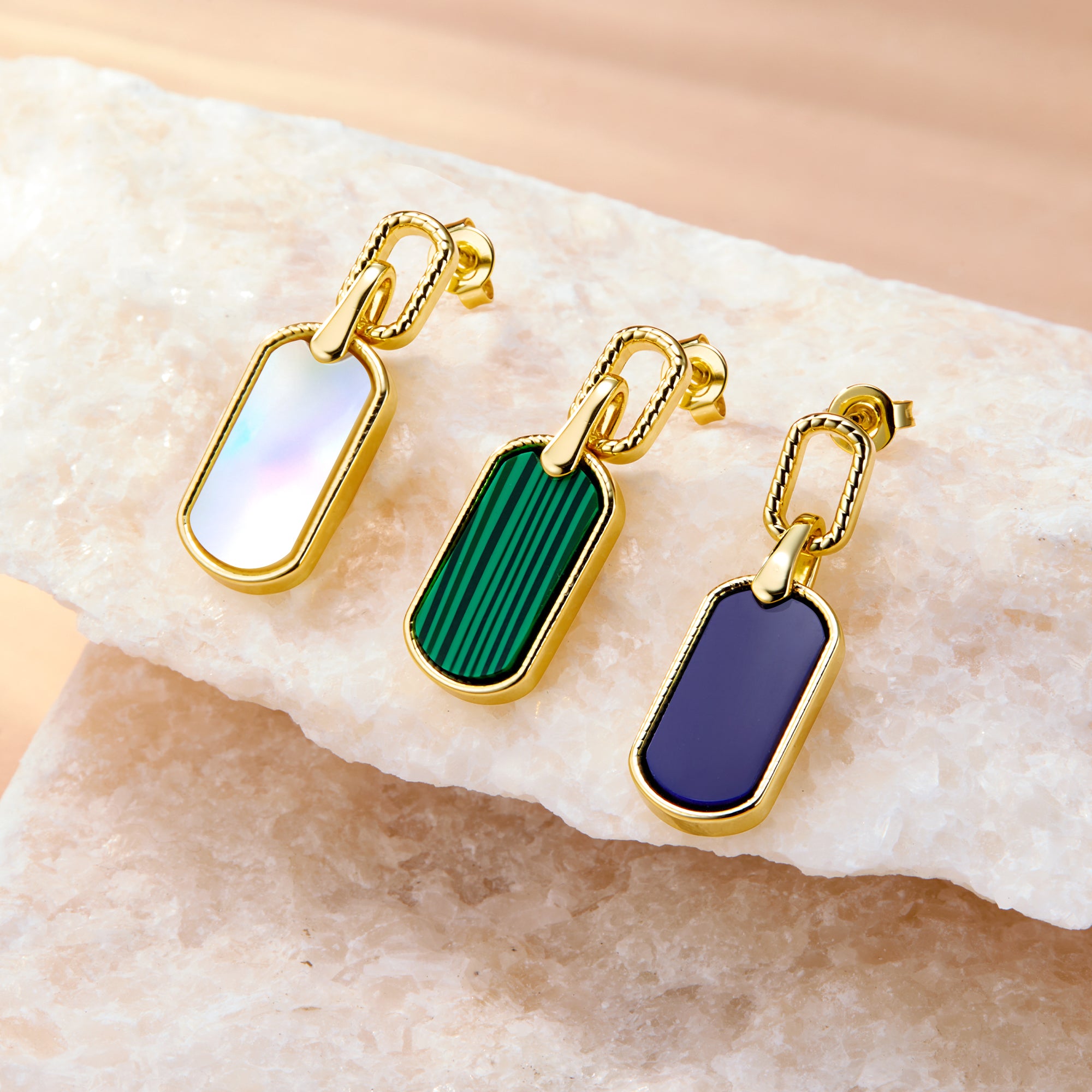 Malachite style statement earrings with green striped rectangular drops and gold-tone frames.