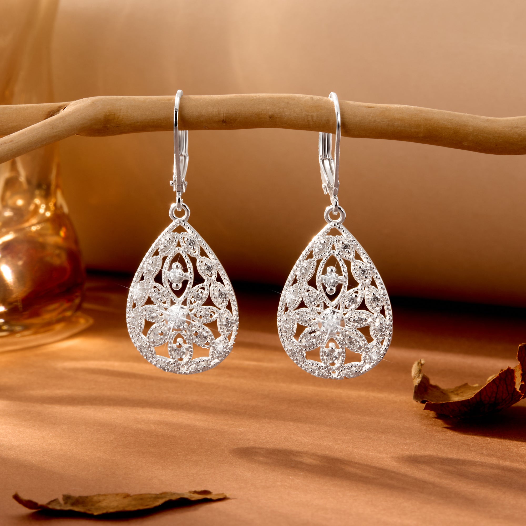 Silver Filigree CZ dangle earrings, teardrop filigree design with round stone centers.
