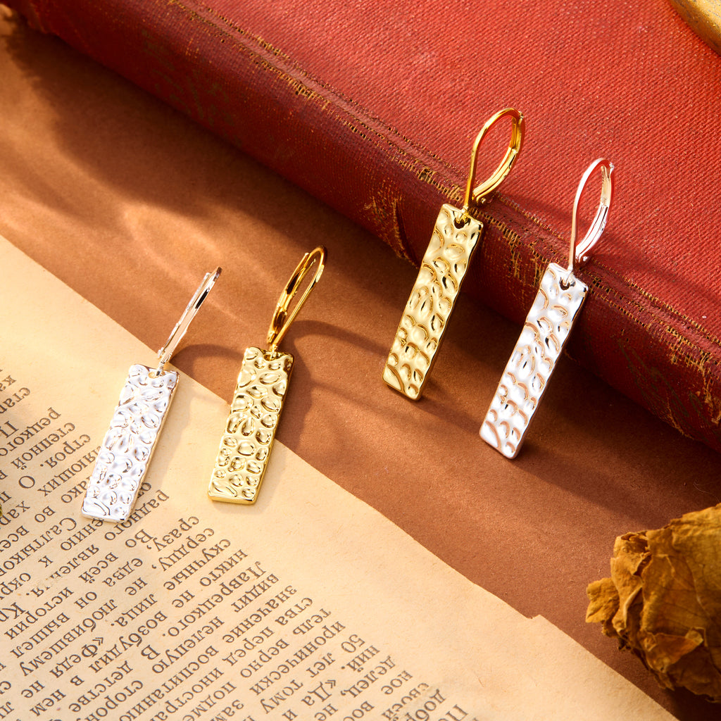 Hammered bar drop earrings in gold and silver tones, with rectangular textured dangles