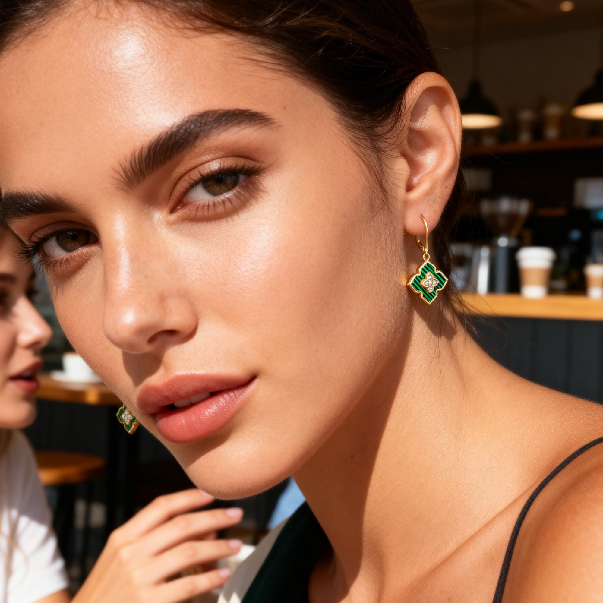 Four-leaf clover drop earrings with malachite green enamel and crystal cross