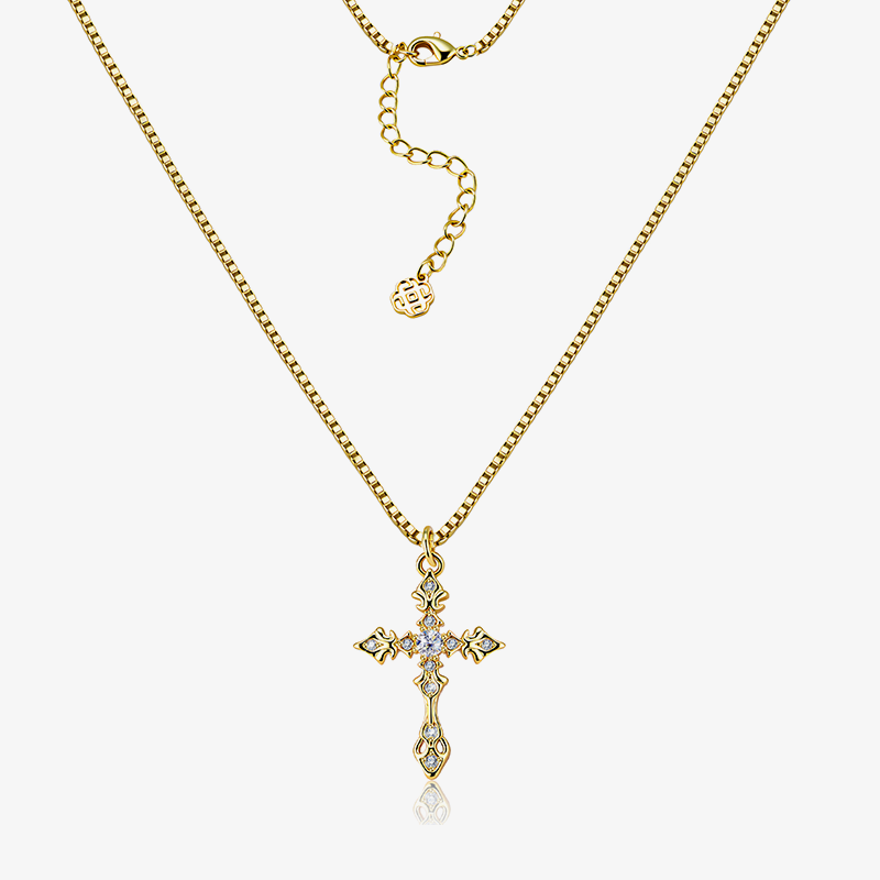 Gold-tone CZ cross necklace with adjustable chain and small blue-stone pendant