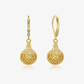 Gold hollow lantern earrings with ornate cutout globe and dangling bead accents