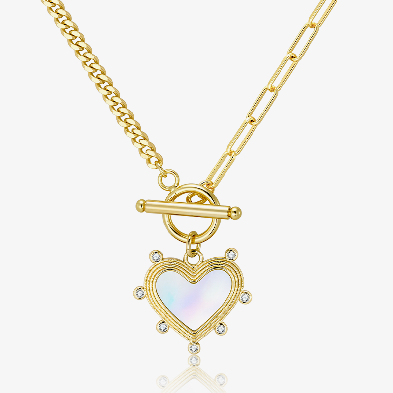 Gold heart pearl charm necklace with oval clasp and glittering stone details