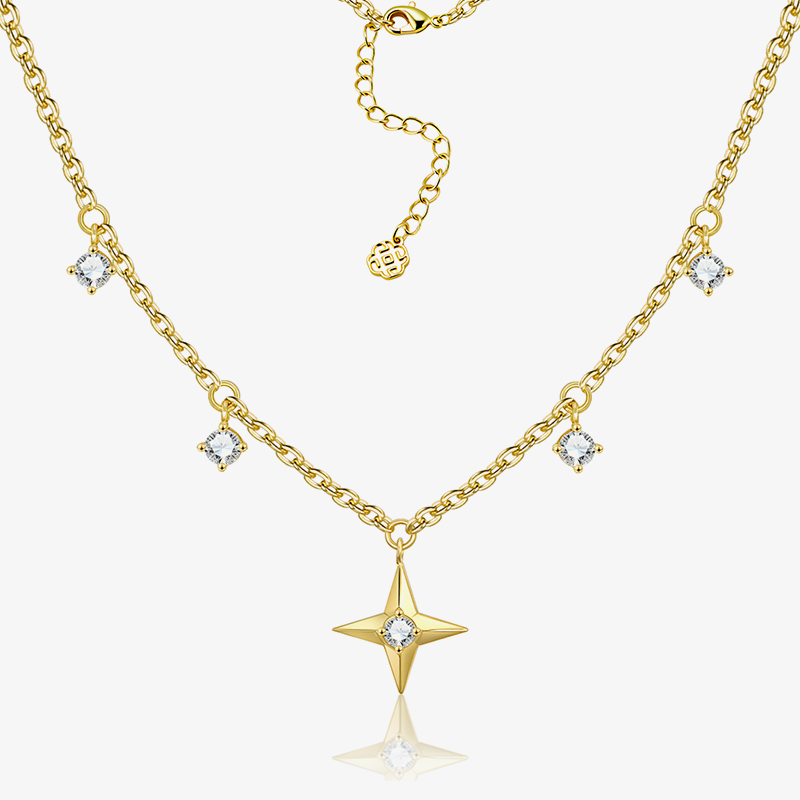 Gold-tone chain necklace with central star pendant, zircon accents, and small charm links