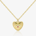 Gold paperclip chain necklace with embossed heart pendant and red gemstone center