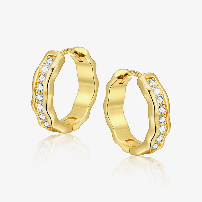 Gold hoop earrings with embedded stones on a white background