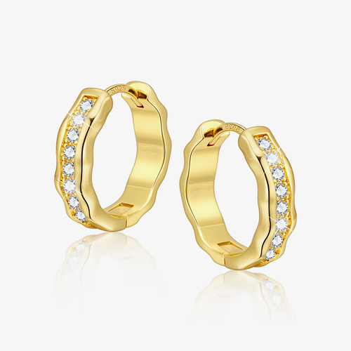 Gold hoop earrings with embedded stones on a white background
