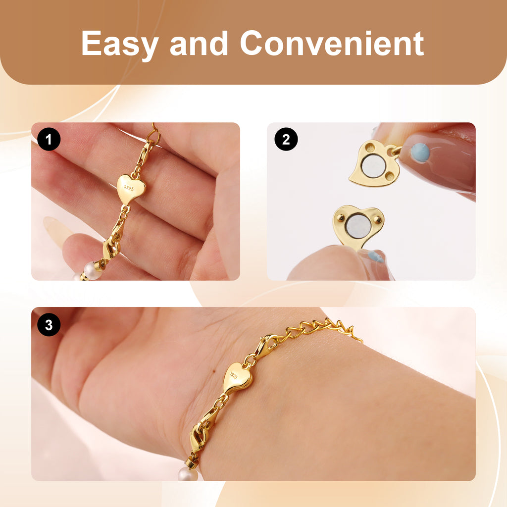 Gold heart chain extender with heart charm and clasp links on a hand
