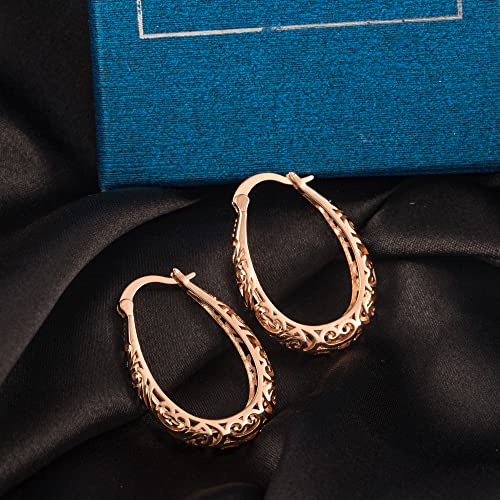 Fancy Cut Out Twisted Hoop Earrings in Yellow Gold | Costco